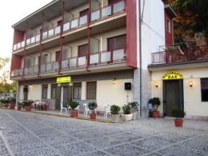 a building with a balcony on the side of it at MillePini in Calatafimi