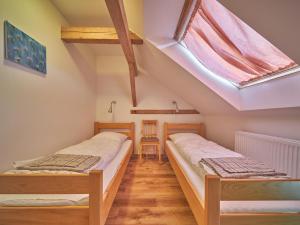 Katil atau katil-katil dalam bilik di Spacious holiday in Lampertice near ski area