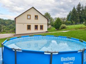 a large pool in front of a house at Holiday Home in Lampertice with Swimming Pool in Lampertice