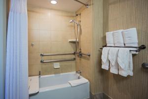 a bathroom with a shower, sink, and toilet at Crowne Plaza Hotel-Newark Airport, an IHG Hotel in Newark