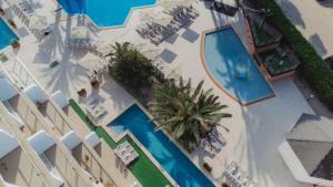 an overhead view of a pool at a resort at Aparthotel Ses Fotges in Playa de Muro