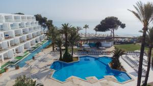 an aerial view of a resort with a swimming pool at Aparthotel Ses Fotges in Playa de Muro