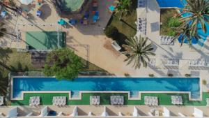 an overhead view of a resort with a swimming pool at Aparthotel Ses Fotges in Playa de Muro