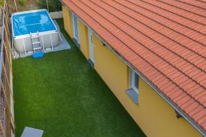 an overhead view of a swimming pool on a house roof at HOLIDAY HOME IVA, Proložac - Makarska in Donji Proložac