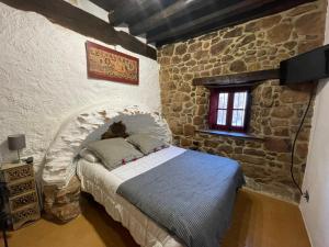 Łóżko lub łóżka w pokoju w obiekcie Casa Rural Zirimiri en Herreros, Soria