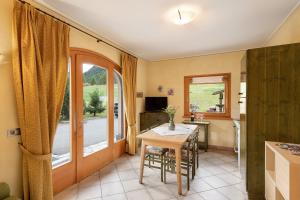 A television and/or entertainment centre at Terra Chalet Martina