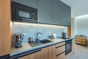 Kuchyňa alebo kuchynka v ubytovaní Apartament Widok