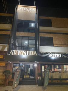 a hotel with a sign that reads avrilada at AVENIDA HOTEL DE RESENDE in Resende