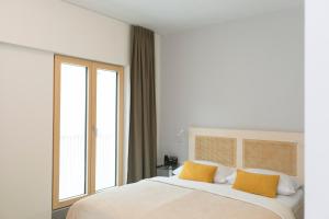 Postel nebo postele na pokoji v ubytování Art Hotel