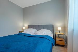 Posteľ alebo postele v izbe v ubytovaní Apartament Widok