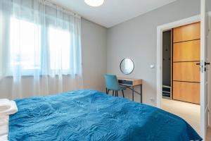 Posteľ alebo postele v izbe v ubytovaní Apartament Widok