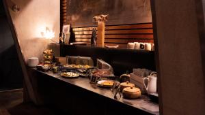 a kitchen counter with food items on it at "Quality Hosts Arlberg" Hotel Lux Alpinae in Sankt Anton am Arlberg