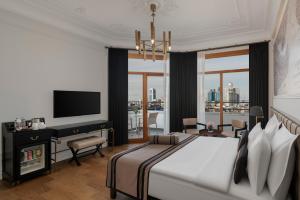 A television and/or entertainment centre at AKKA Lush Hotel Taksim