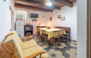 a kitchen and dining room with a table and chairs at Almachiara in Sessa Cilento