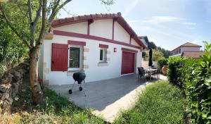 a house with a camera in front of it at location 1 semaine minimum classé 3 étoiles in Aldudes