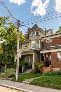 a house on the corner of a street at Cozy 5 Bedroom House in Downtown Toronto by GLOBALSTAY in Toronto