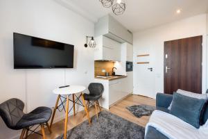 Televízia a/alebo spoločenská miestnosť v ubytovaní City Centre High Floor View Apartments