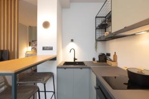 a kitchen with a sink and a counter at K4 0 City Apartments, Historical Center, Thessaloniki #FeelsLikeHome in Thessaloniki