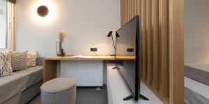 a desk in a bedroom with a bed and a deskictericter at K4 0 City Apartments, Historical Center, Thessaloniki #FeelsLikeHome in Thessaloniki +62 photos