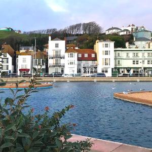 a body of water in a city with buildings at Smugglers Cottage in Hastings