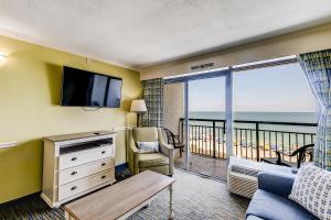 a living room with a view of the ocean at Caribbean Resort 525 in Myrtle Beach