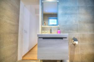a bathroom with a sink and a mirror at Eco-friendly & spacious 1bedroom townhouse PCUT1-1 in Il-Gżira +17 photos