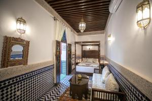 A bed or beds in a room at Dar Hafsa