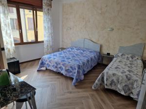 A bed or beds in a room at Le Rustiche Foresteria