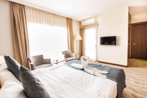 Postel nebo postele na pokoji v ubytování Port View Hotel