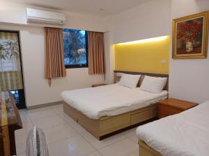 Postel nebo postele na pokoji v ubytování 707 Homestay