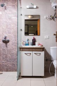 a bathroom with a sink and a shower at Richa's Home in Noida +72 photos