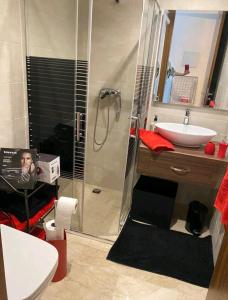 a bathroom with a shower and a sink at Terrasses de Marrakech- Au coeur de Casablanca in Casablanca