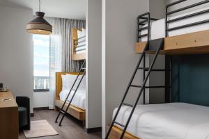 Postel nebo postele na pokoji v ubytování Origin Austin, a Wyndham Hotel