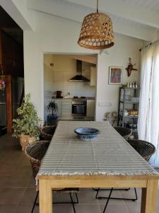 a table with a bowl on it in a kitchen at Ca n'Antonia Formentera in Sant Francesc Xavier