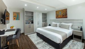Een bed of bedden in een kamer bij Hotel Mokka City