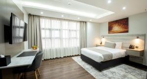 Katil atau katil-katil dalam bilik di Hotel Mokka City