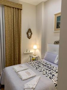a bedroom with a bed with two towels on it at Cozy LUXURY apartments*****. The city center in Valencia