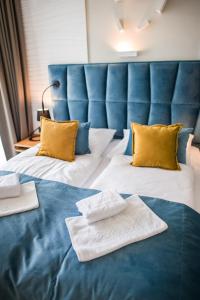 Postel nebo postele na pokoji v ubytování Hotel Zalewski