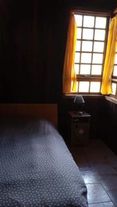 A bed or beds in a room at Chalet Rural Marian