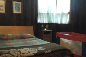 A bed or beds in a room at Chalet Rural Marian