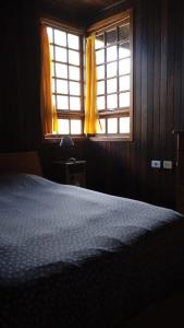 A bed or beds in a room at Chalet Rural Marian