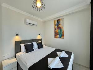 Postel nebo postele na pokoji v ubytování Tatil Premium Lime Suite