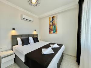 Postel nebo postele na pokoji v ubytování Tatil Premium Lime Suite