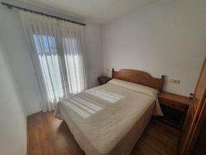 Ένα ή περισσότερα κρεβάτια σε δωμάτιο στο Hostal Apolo XI