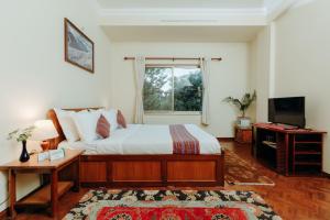 Katil atau katil-katil dalam bilik di Tise Hotel