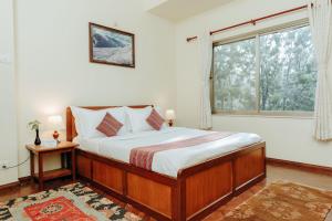 Katil atau katil-katil dalam bilik di Tise Hotel