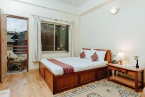 Katil atau katil-katil dalam bilik di Tise Hotel