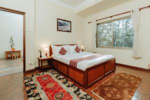 Katil atau katil-katil dalam bilik di Tise Hotel