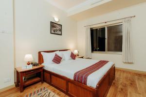 Katil atau katil-katil dalam bilik di Tise Hotel