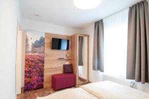 Letto o letti in una camera di Glockenhof Studtmann